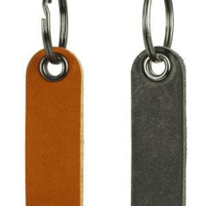 Two Ave Maria Leather Keychains on a white background.