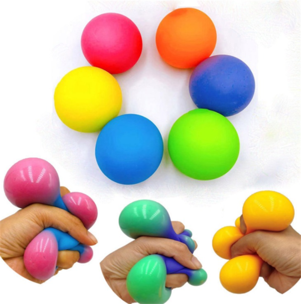 A group of hands holding Pop Fidget Toys.