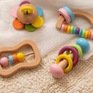 A group of Baby Rattles-Toys on a carpet.