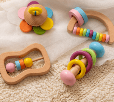 A group of Baby Rattles-Toys on a carpet.