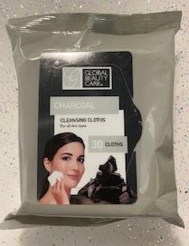A pack of facial wipes charcoal on a table.